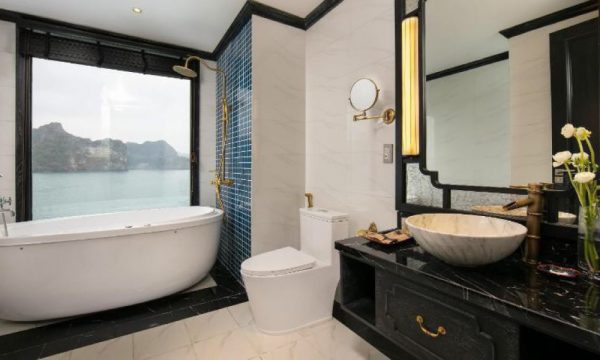 The verdure lotus luxury cruise with Halong Bay islands behind.