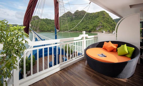 The verdure lotus luxury cruise with Halong Bay islands behind.
