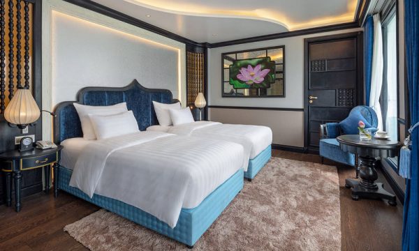 The verdure lotus luxury cruise with Halong Bay islands behind.