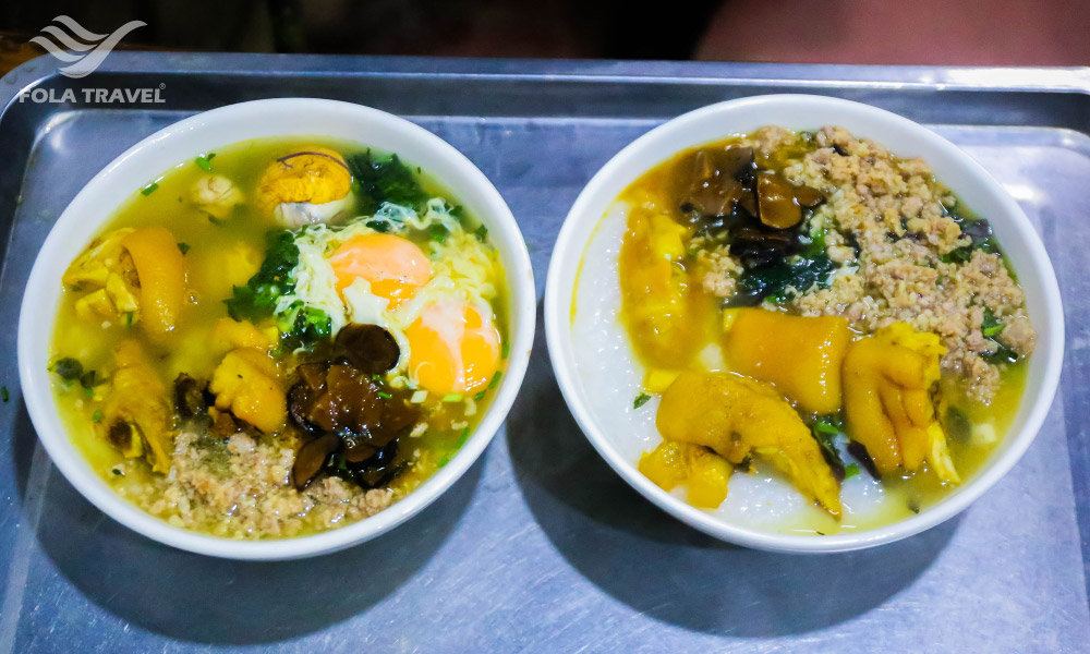 Two bowls of au tau porridge with pork minced and eggs.