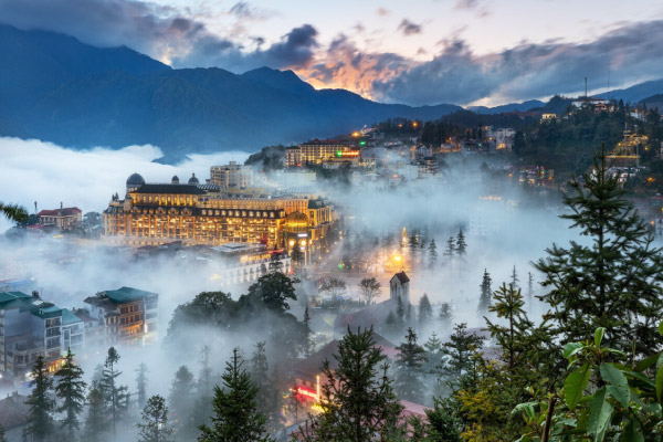 Banner Sapa city in clouds.