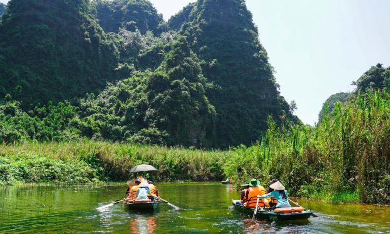 Bamboo boats riding on the river of Ninh Binh.