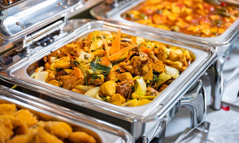 A tray of stir fired chicken with veggie.