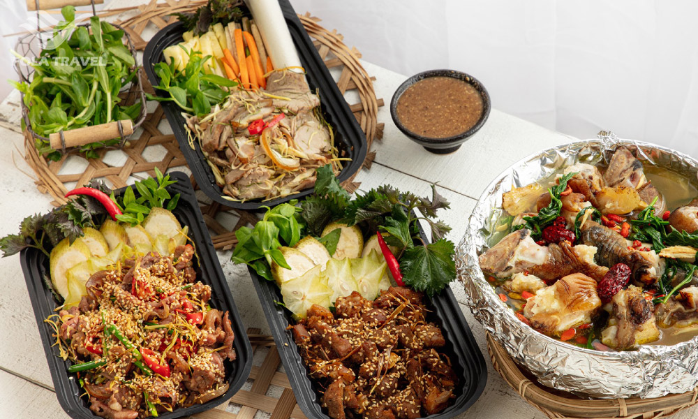 Four dishes made from wild goat meat in takeaway containers.