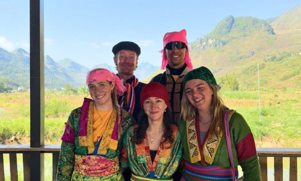 Five foreigners wearing ethnic clothes.