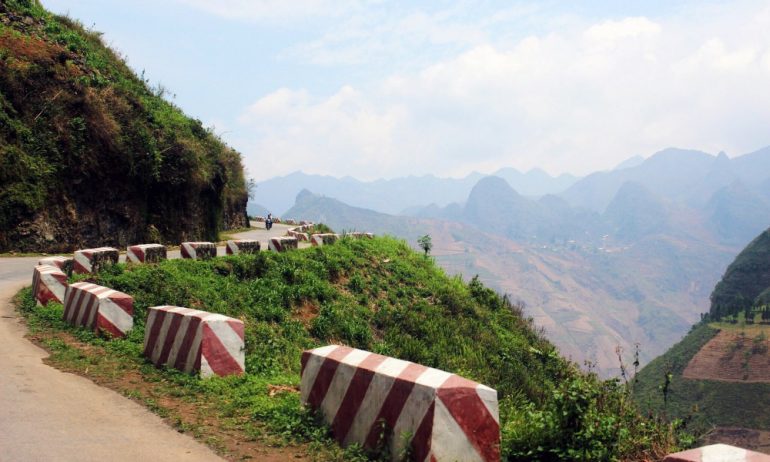 Part of a road in Ha Giang looking out to the mountains.