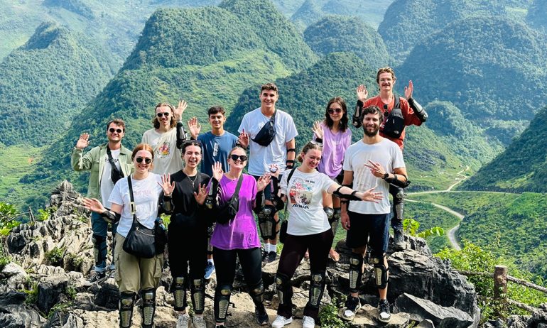 A group of friends in front of Quan ba mountains.