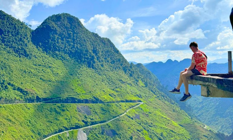 Man looking at view of Ha Giang Loop.