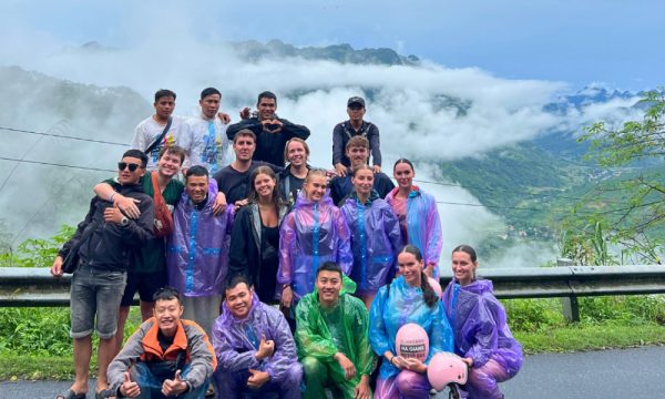 Ha Giang loop visitors wearing raincoats.