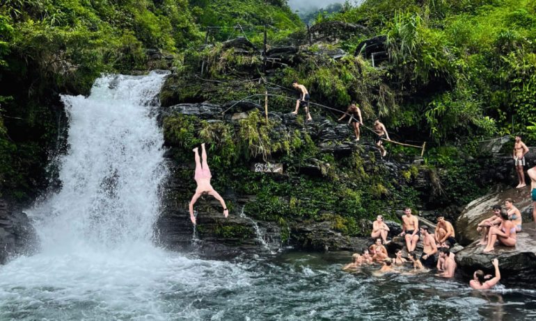 Guests playing in Ha Giang waterfall.