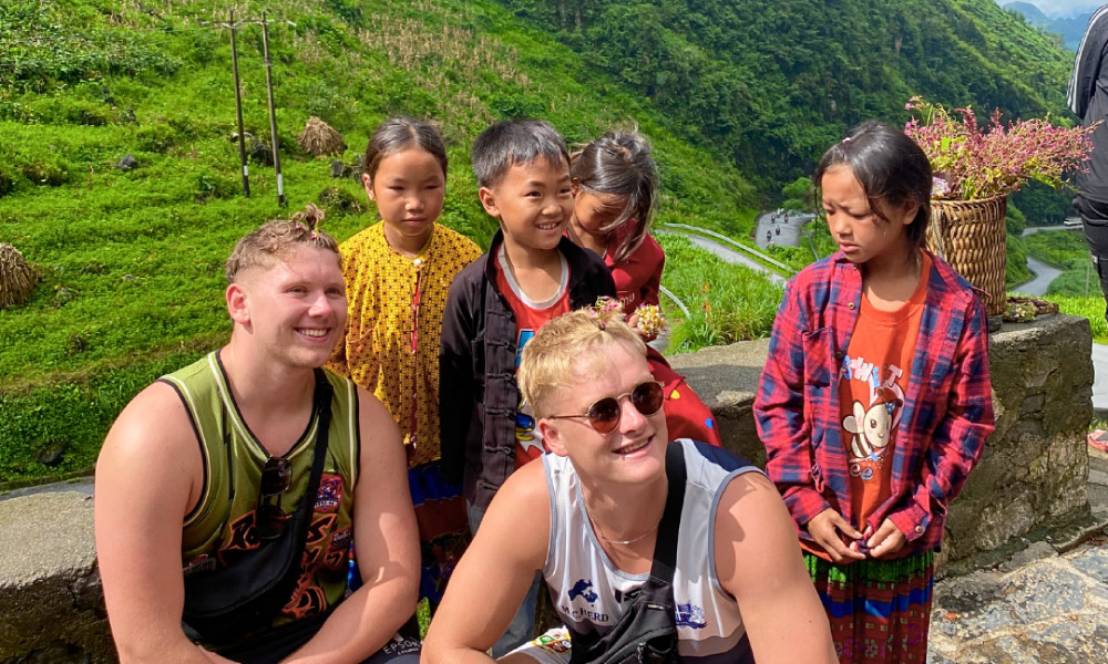 Ha Giang visitors meet ethnic children.