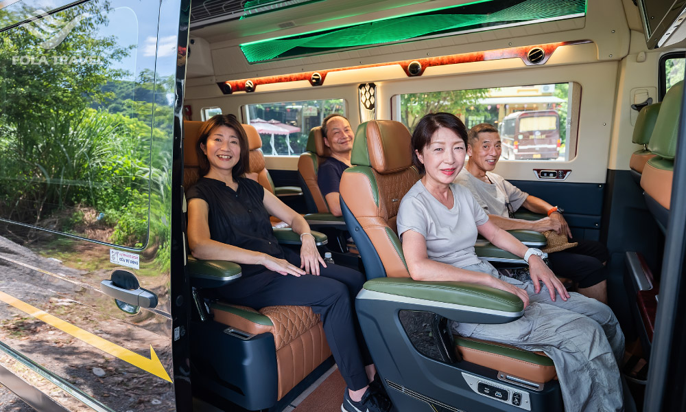 Four people sitting on a bus to go to Ninh Binh.