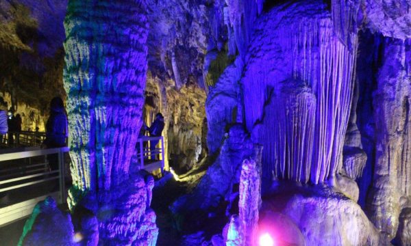 Inside the Lung Khuy Cave with blue stalactites.