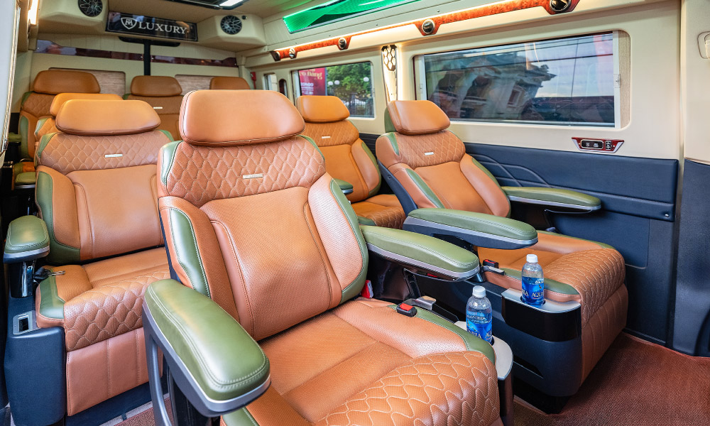 Seven leather chairs inside a luxury car.