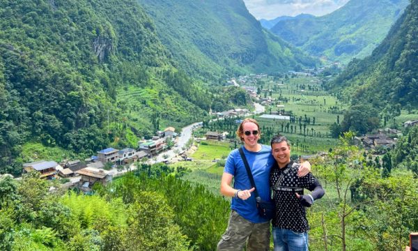 Two people in front of Sung La valley view.