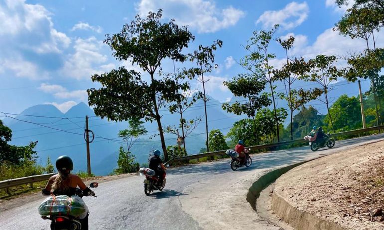 Four motorbikes going on Ha Giang road.