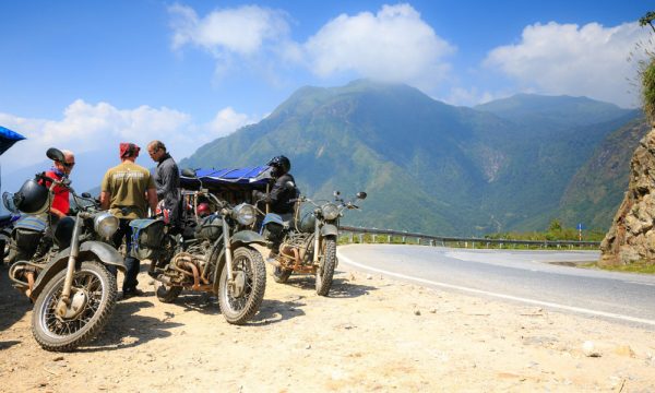 People and motorbikes on the roadside in Sapa.