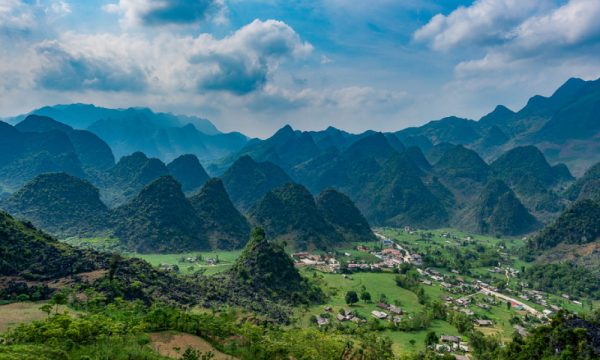 Mountain ranges in Ha Giang and village in the valley.