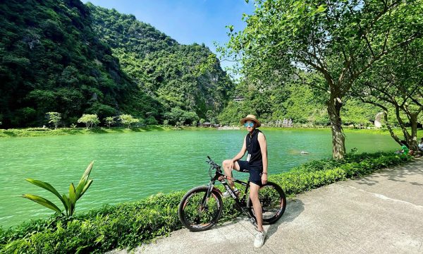 A male guest on a bike in Ninh Binh.