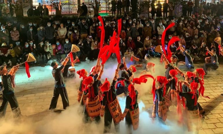 A festival in Sapa with ethnic people dancing.