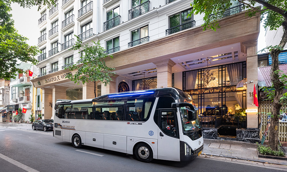 A cozy thaco limousine with the white exterior.