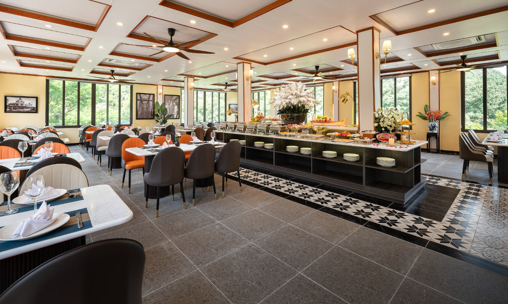 Side view of the restaurant in Ninh Binh with big windows looking out to the forests.