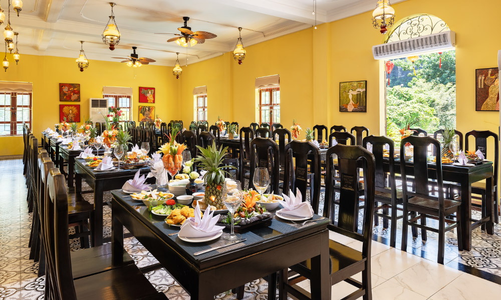 Dining room with black chairs at Cozy Vietnam restaurant in Ninh Binh.