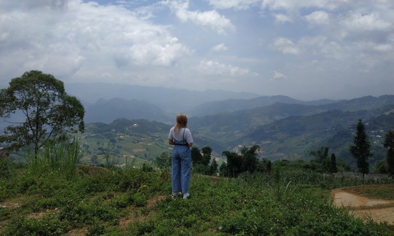 A girl sightseeing in Ha Giang mountains.