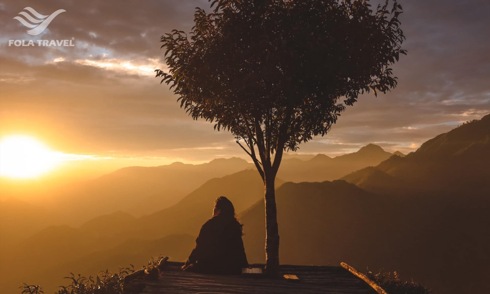 A girl looking at Sapa sunset view.