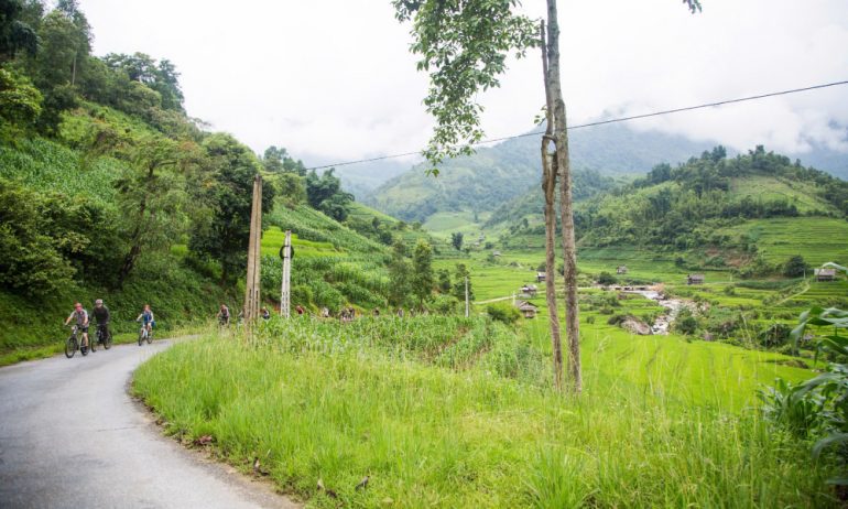 Tourists cycling in Sapa.