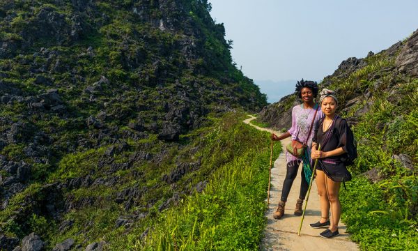 Two woman with trekking sticks in Dong Van Karst Plateu.