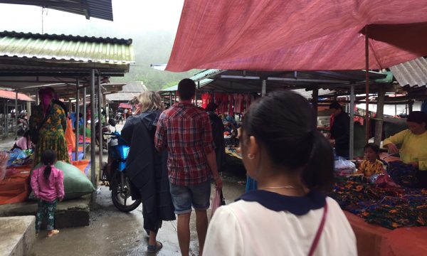 People going in a market in Ha Giang.