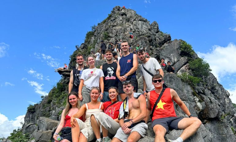 Ha Giang visitors on Dong Van karst mountain.