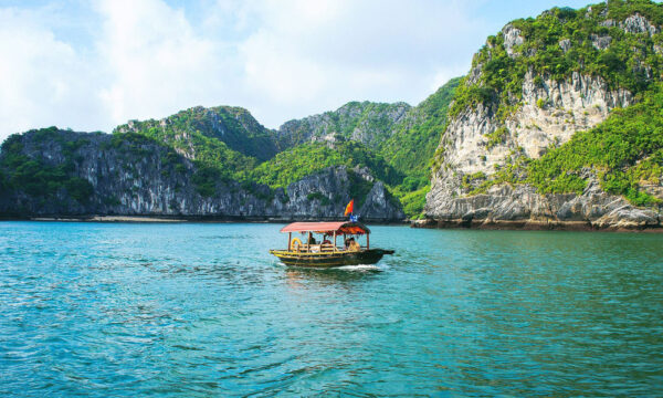 A boat sailing in Cat Ba archipelago.