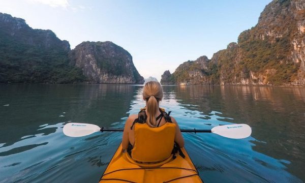 A girl on a kayak in bai Tu Long Bay.
