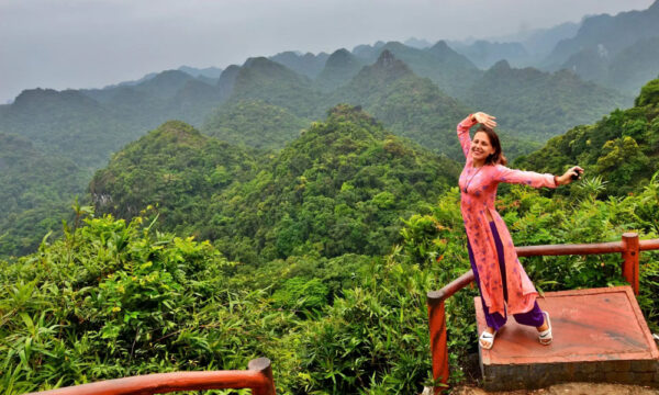 A guest wearing Ao Dai on Cat Ba observatory.