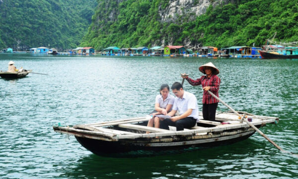 Guests on a bamboo boat ride in Ba Hang Fishing Village.