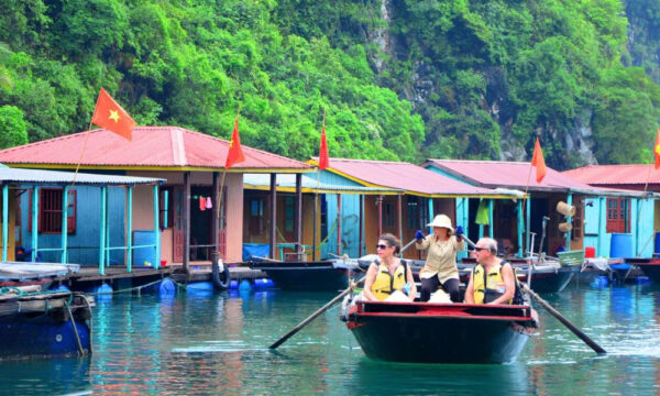 Bamboo boat ride through Cua Van Fishing Village.