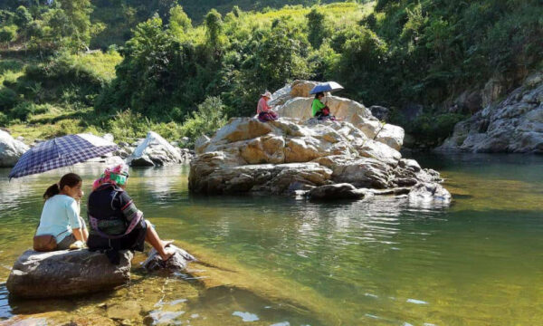 Ban Ho locals and guests enjoy the cool stream.