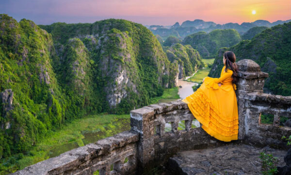 Beautiful girl on top of Mua Caves viewpoint.