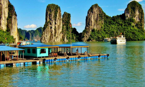 Colorful floating houses in Cua Van Fishing Village.