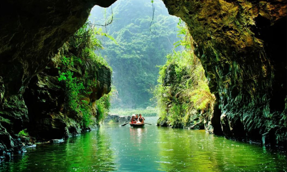 Boat ride through Trang An Cave.