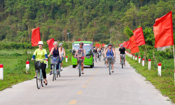 Guests cycling on the road through Viet Hai Village.