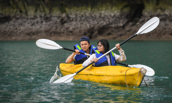 A couple on a yellow kayak in the Frog Lagoon.