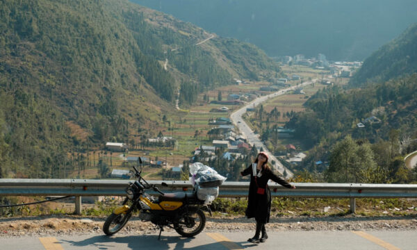 Guests on motorbike across Meo Vac.
