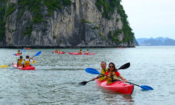 Guests kayaking in Bai Tu Long Bay.