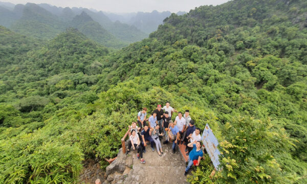Guests on a mountain peak in Cat Ba National Park.