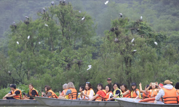 Guests on boat ride in Thung Nham Eco-tourism Park.