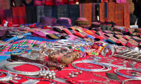 Bac Ha Market products: handmade brocades and silver jewelry.