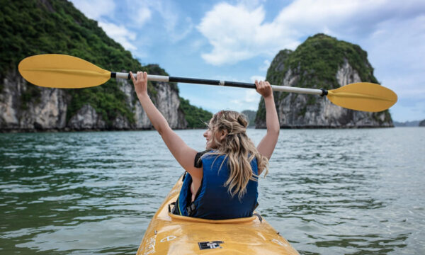 A girl kayak in Tra Bau Fishing Village.